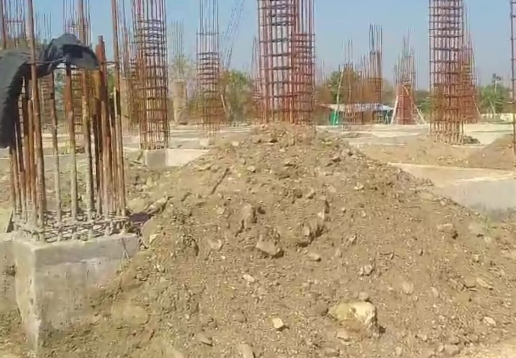 Foundation pillars at the PM Excellence Science College construction site, highlighting structural progress