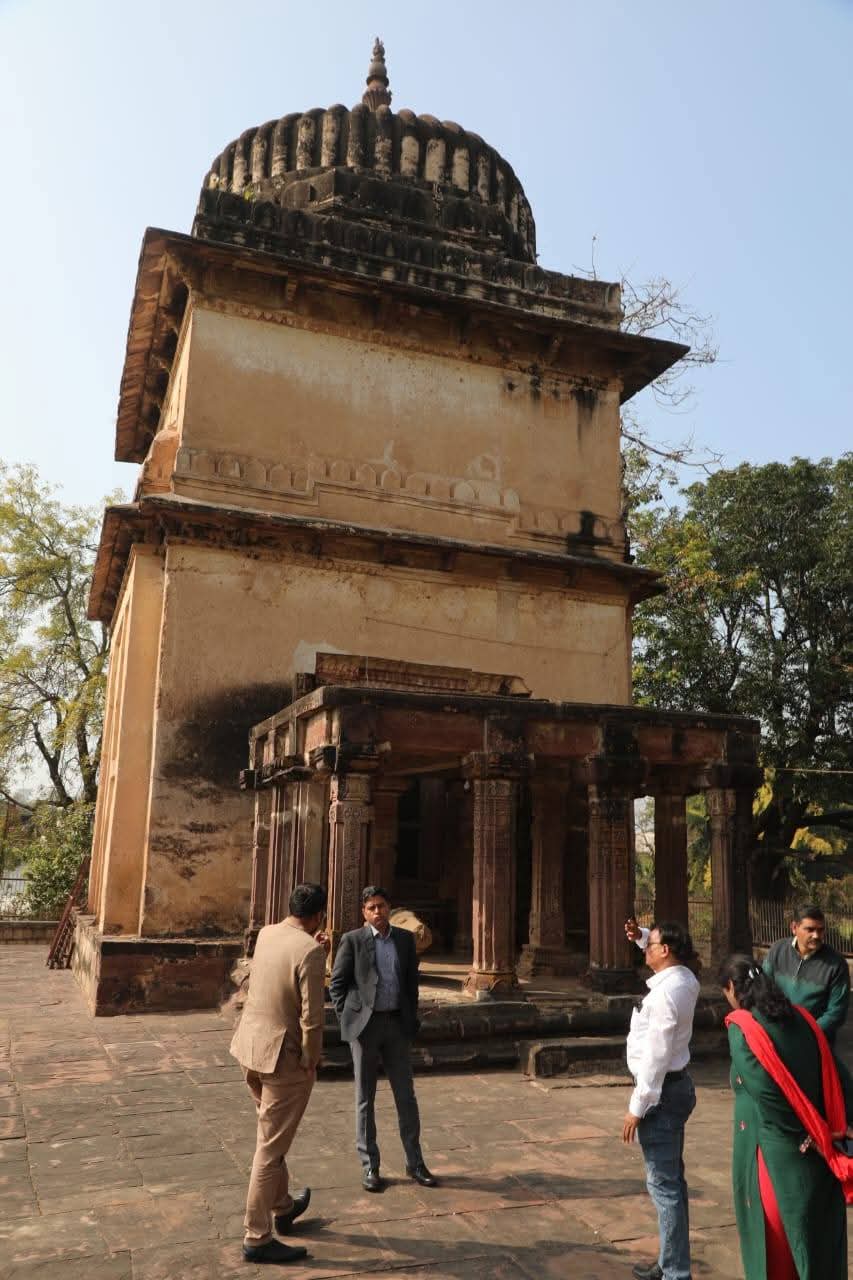 Collector Dilip Kumar Yadav inspecting a historic monument site with officials.