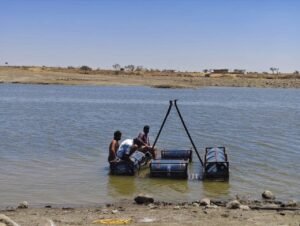 Dried-up lake in Dhar with empty water vessels showing severe water crisis in the 'City of Lakes