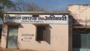 Scattered school records on the road in Shivpuri highlighting negligence by the education department