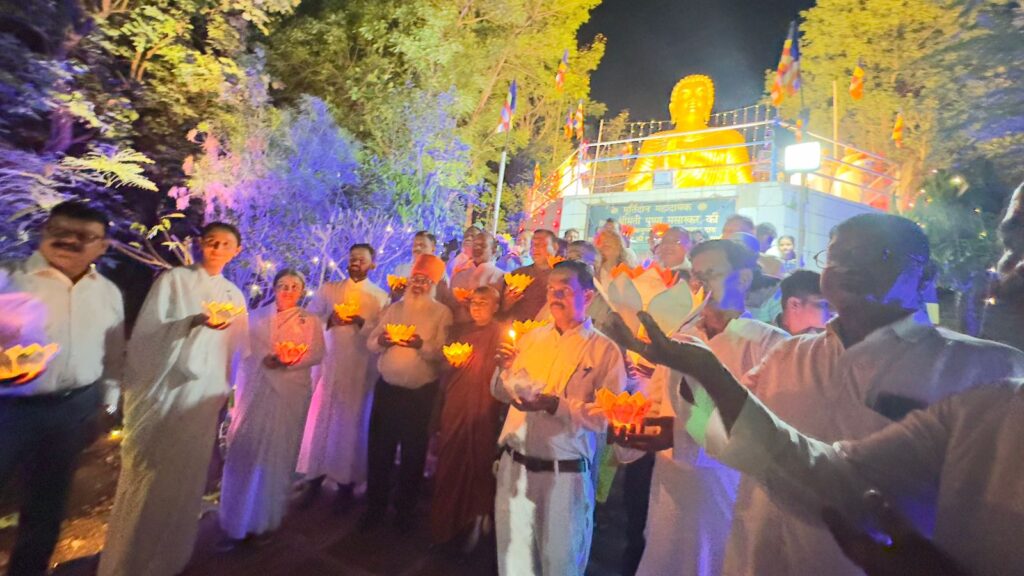 Religious leaders from Hindu, Muslim, Sikh, Christian and Jain faiths jointly lighting diyas before 25-ft Buddha statue in Bhopal