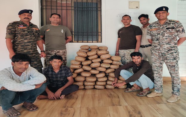Chhattisgarh police inspecting seized ganja from truck in Kwardha drug bust operation