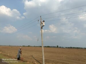 Collapsed electricity pole on Gyarsapur road with villagers standing nearby