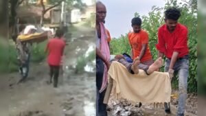 Villagers carrying patient on cot due to broken road in Jevar, Tikamgarh