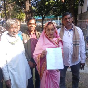 Illegal sand mining in Doodhi River at Kesla, heavy machines extracting sand and villagers raising protest.