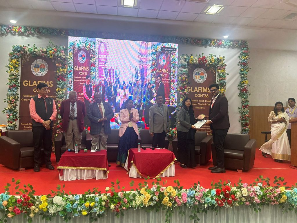 Dr Vivek Chouksey receiving international forensic research award at global conference representing Atal Bihari Vajpayee Medical College Vidisha